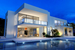 luxurious villa with swimming pool at dusk